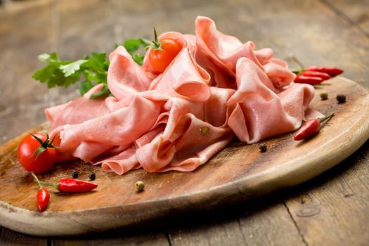 Mortadella slices with red pepper