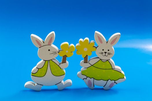 Easter bunnies on blue background
