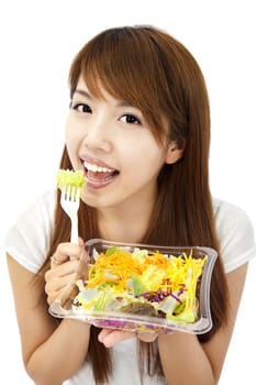 young asian woman holding  vegetable and salad