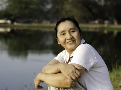 Happy asian woman in the park