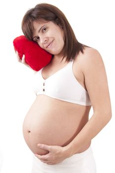 Pregnant woman hugs her belly
