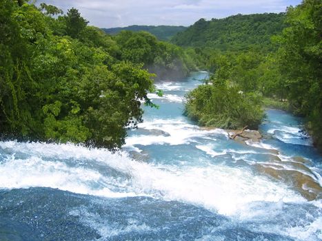 Agua Azul waterfalls blue water river in Mexico