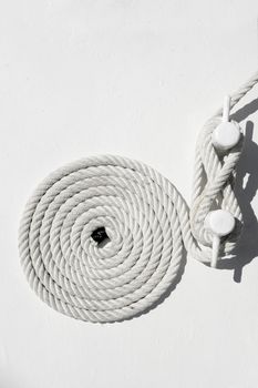 spiral white sea nautical rope on boat mooring