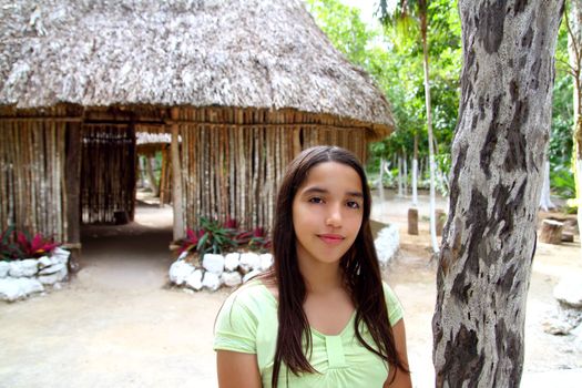 Indian girl in jungle palapa hut house rainforest