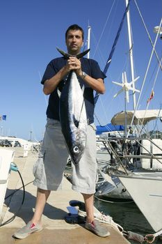 Angler fishing big game Albacore tuna on Mediterranean