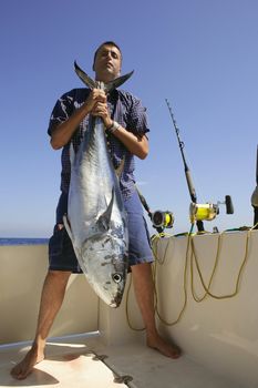 Angler fihing big game bluefin tuna on Mediterranean