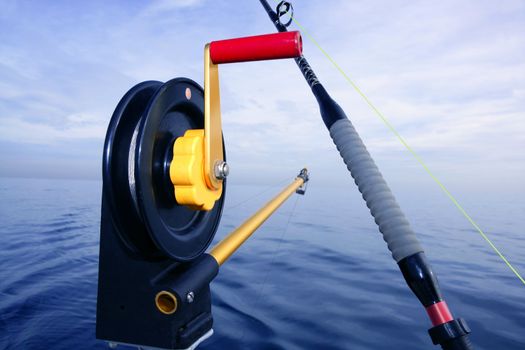 Downrigger angler fishing tackle in blue sea