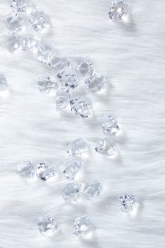 crystal ice cubes on winter white fur