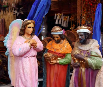 saint and virgin  figurines in mexican market