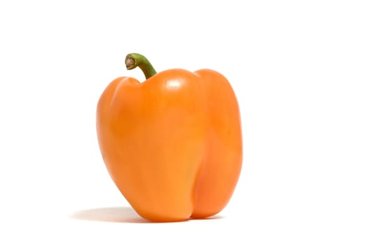 A single orange pepper isolated on a white background