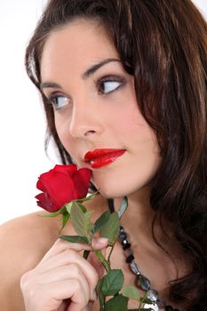 beautiful brunette with a red rose