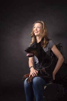 Woman with dobermann dog 