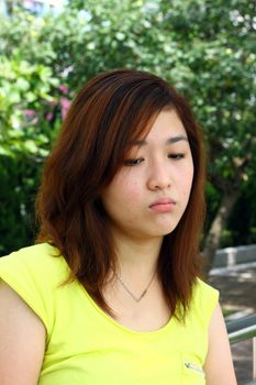 Asian woman with sad face