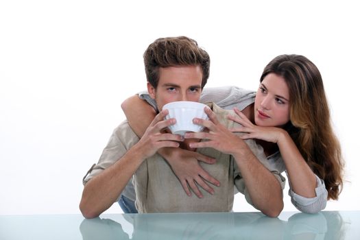 Couple with large bowl of coffee
