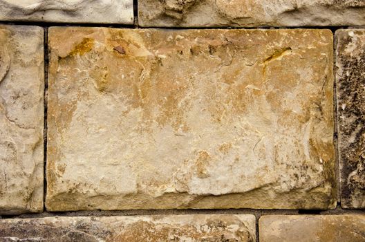 ancient building walls of stone blocks background 