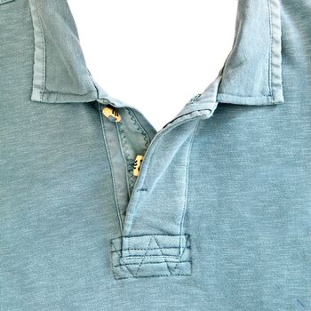 Close up of the collar of a casual man's top