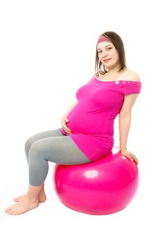 pregnant woman with a fitmess ball