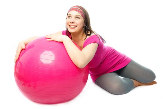happy pregnant woman with a fitness ball