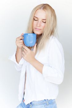 Blond female with cup of tea