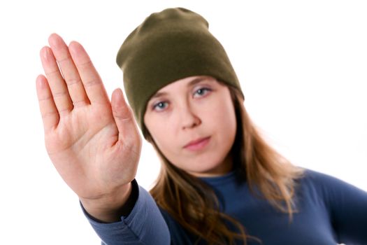 An image of a nice woman in a green hat showing sign stop
