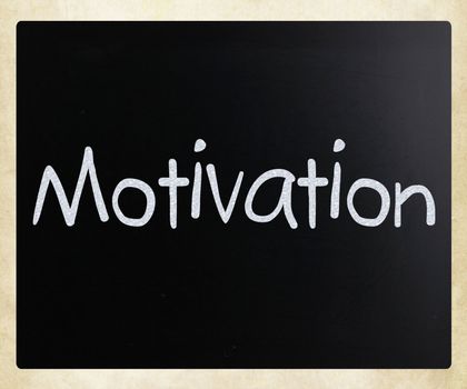 "Motivation" handwritten with white chalk on a blackboard