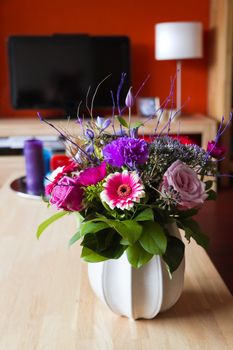 Flower bouquet on table in modern interior 