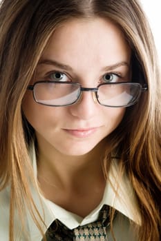 An image of a young woman in glasses