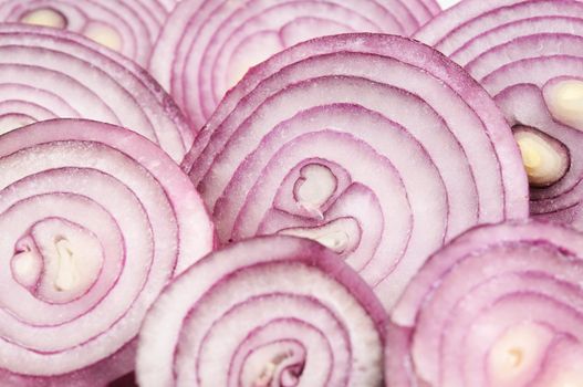 Chopped red onion circles. Close up photo.