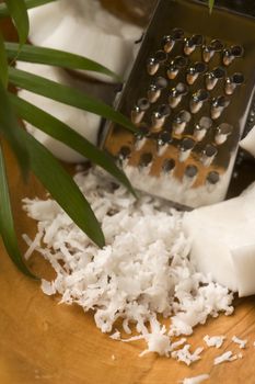 Grated coconut with grater and nut 