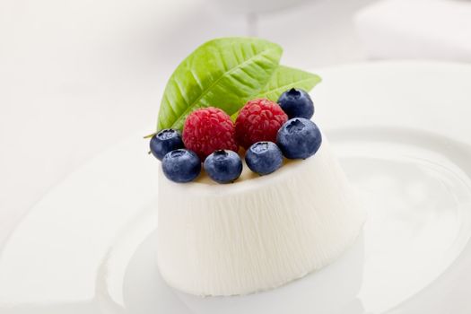 Panna cotta with Berries on white table
