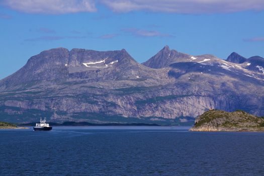 Ferry passing through fjord