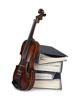 Old classical violin with  books