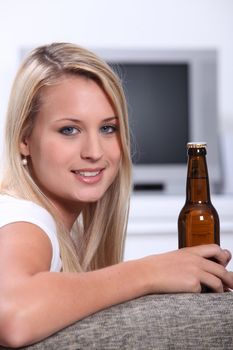 Teenage girl with a bottle of beer