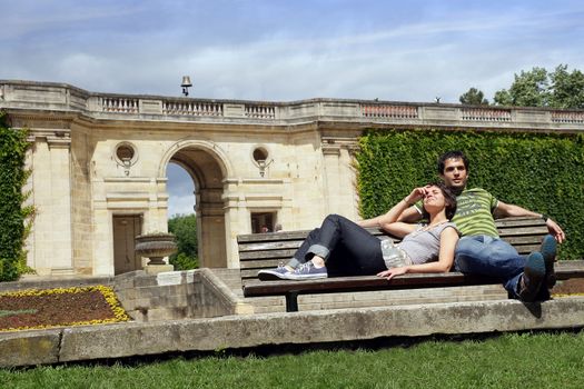 Couple sat on park steps