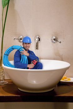 "reduced size" plumber in washbowl