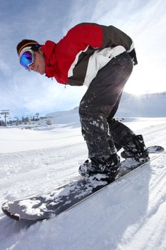 Adrenaline junkie snowboard down hill