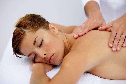 Woman having a soothing back massage