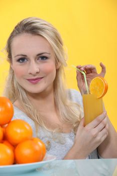 Woman with glass of orange juice