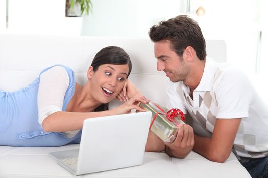 Man offering present to wife