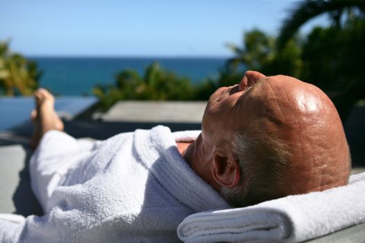 Senior man having sunbath