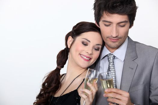 Couple celebrating engagement with champagne