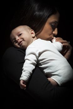 Ethnic Woman Kisses Her Newborn Baby Hand