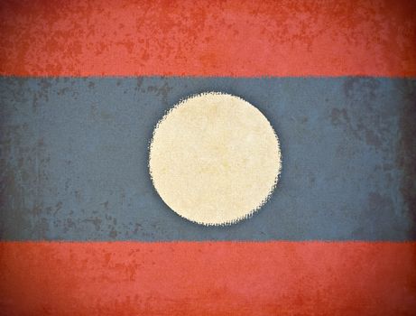 old grunge paper with Laos flag background
