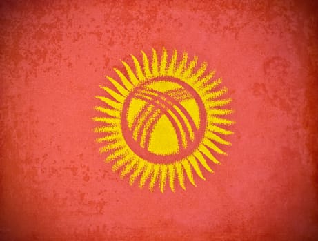 old grunge paper with Kyrgyzstan flag background