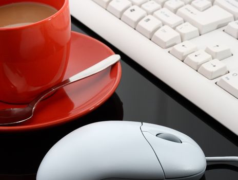 Keyboard And Mouse And A Cup Of Coffee In An Office