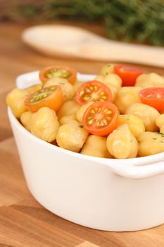 chickpea or garbanzos slow cooked, mixed  with cherry tomatoes and chopped parsley  