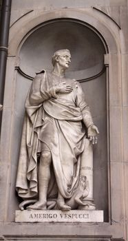 A statue Amerigo Vespucci sitting outside of the Uffizi, in Florence, Italy.  Amerigo Vespucci was an explorer/navigator whose name derived the name for North and South America.
