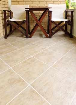 Chairs and table on tiled floor