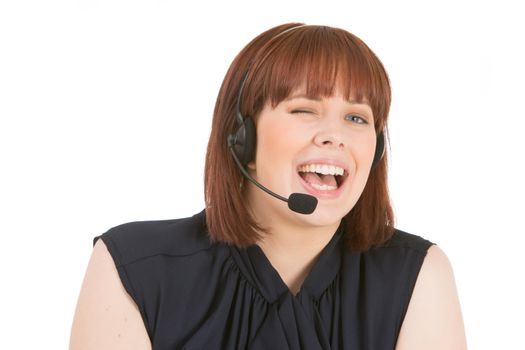 Laughing call centre operator winking