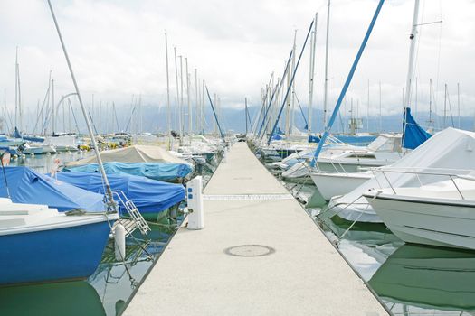 yachts and boats in the harbor in Ouchy, Switzerland